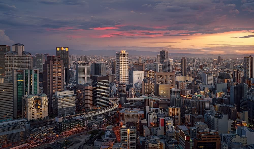 A stunning cityscape at sunset with illuminated buildings